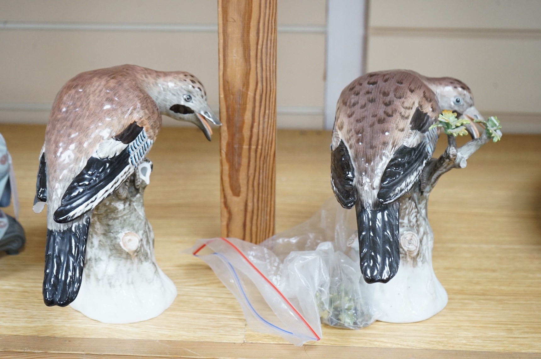 A pair of Meissen style porcelain models of Jays, 18cm